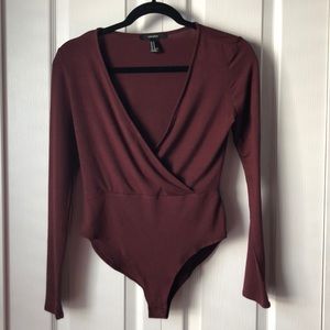 Burgundy long-sleeve top.